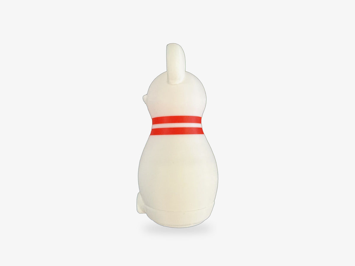Left side of a Mouse Bowling pin, showing the mouse's ear and two red neck stripes