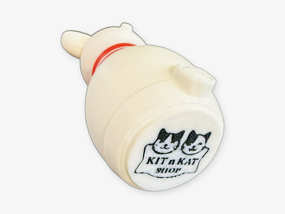 Bottom of a Mouse Bowling pin showing the black Kit n Kat Shop cat logo